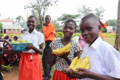 1.-As-our-core-value-we-value-health.-Learners-of-Mudakori-proudly-show-off-the-fruits-they-received-from-Organic-Impact