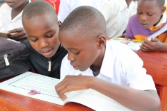 1.-Excited-Pupils-of-Mudakori-Primary-School-InTororo-looking-through-the-reading-matrials-they-received
